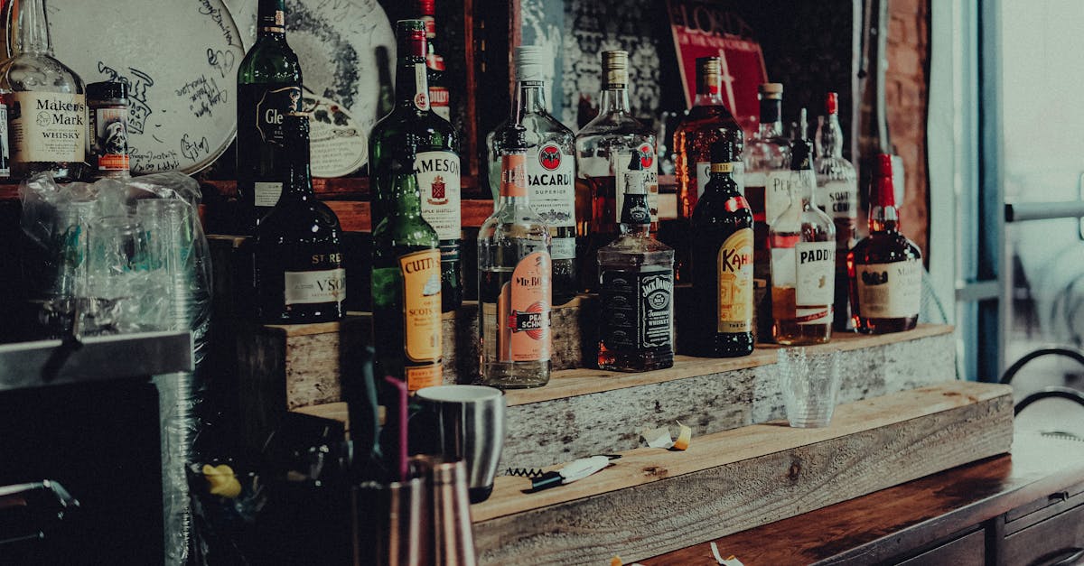 Which wholesale alcohol distributor delivers across Queensland, and what order total qualifies for free delivery?