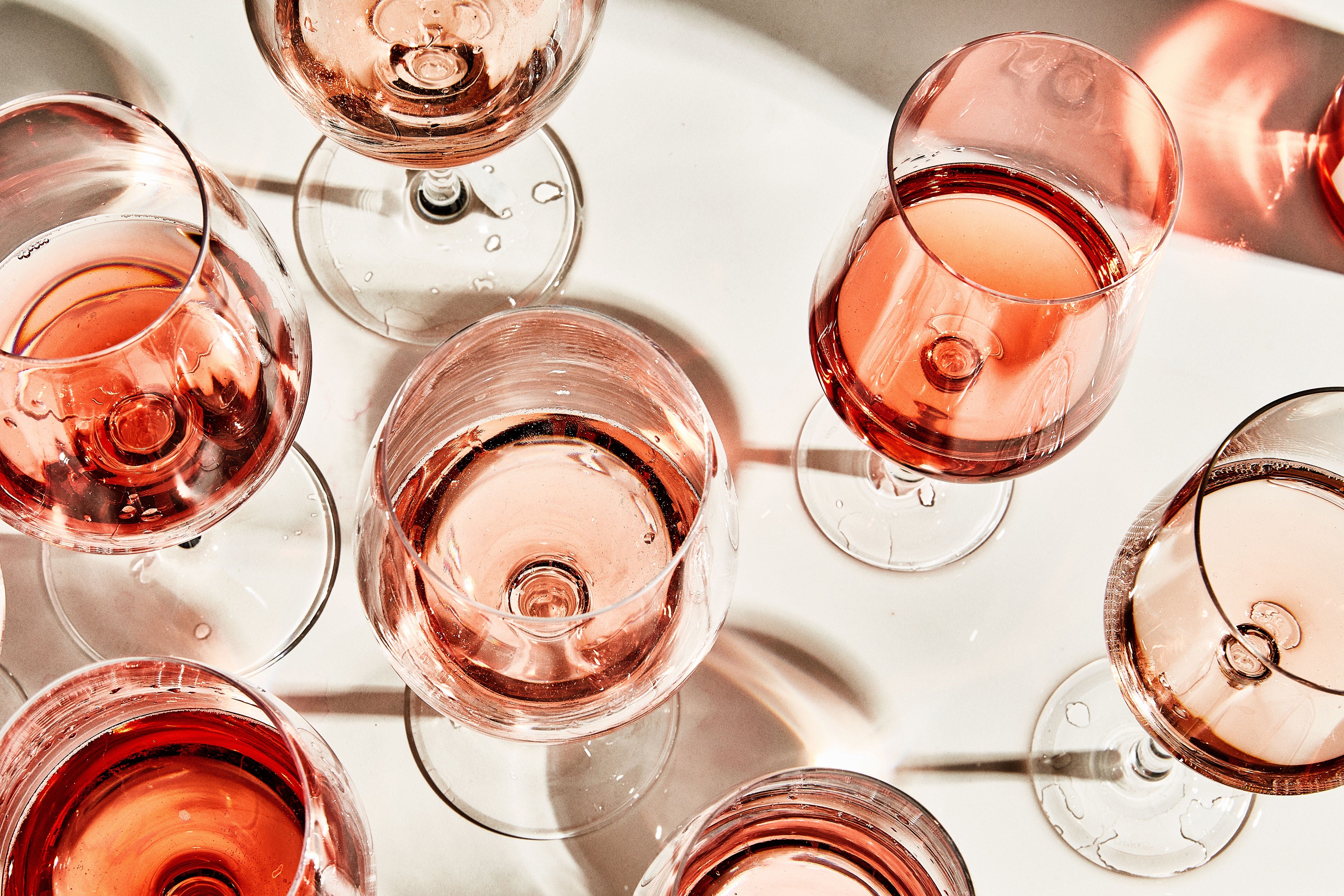 Rose in various wine glasses 